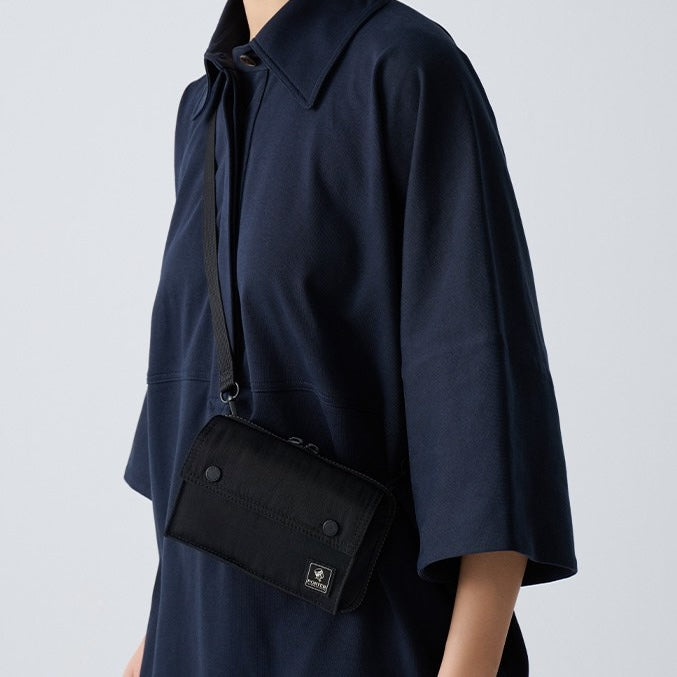 PORTER INTERNATIONAL Mid Shoulder Bag S Black textured fabric crossbody bag flap pocket adjustable strap compact design