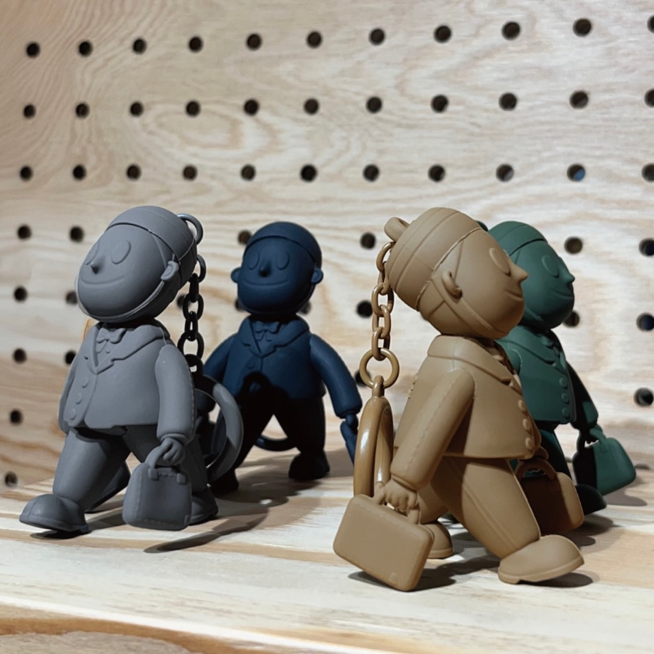 PORTER INTERNATIONAL Porter Man Keychain GWP Grey Green Blue Camel Brown character keychain collectible bag accessory monochrome design
