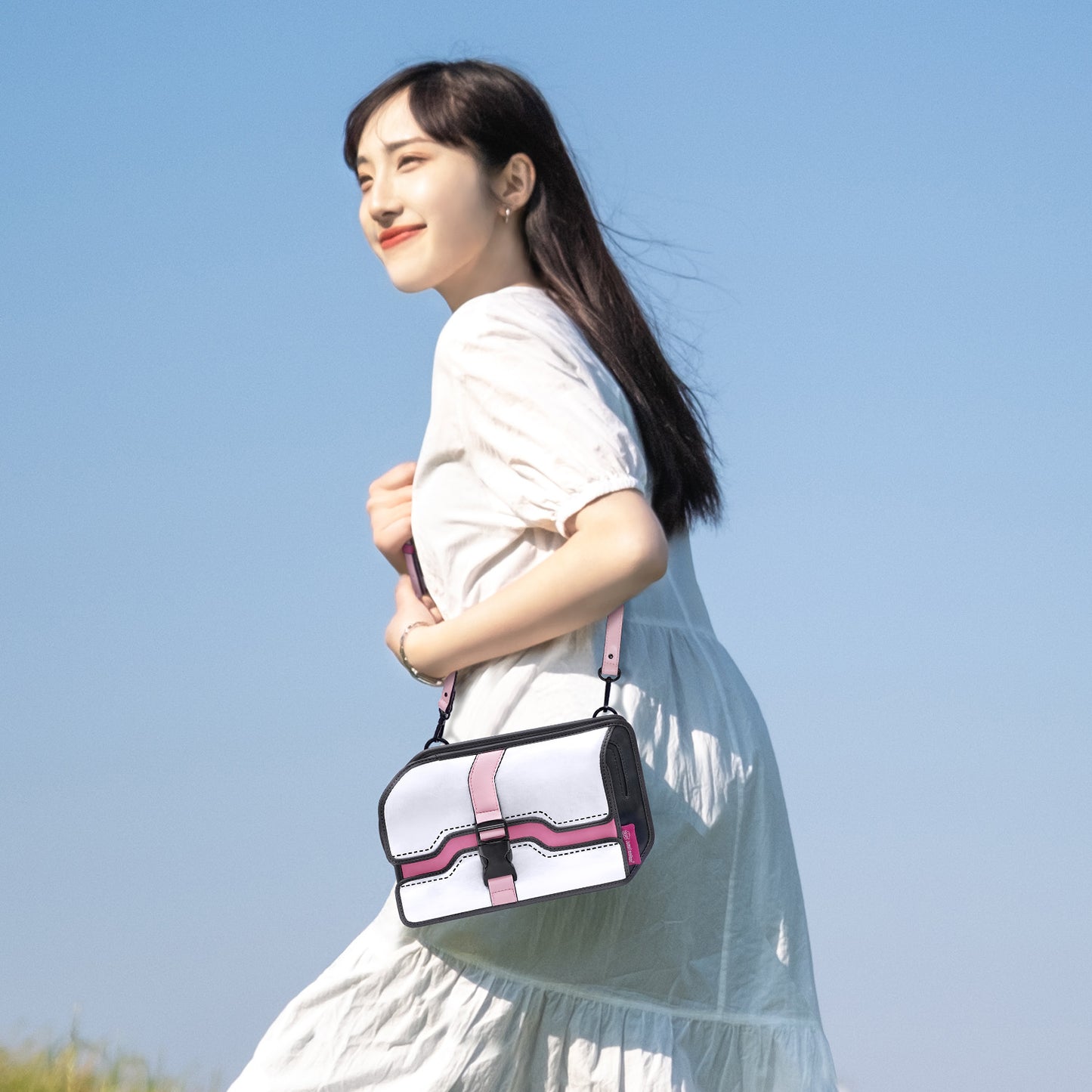 JumpFromPaper Neo Box 'Nebula Pink' – white and pink 2D illusion box-style crossbody bag with adjustable strap, front view