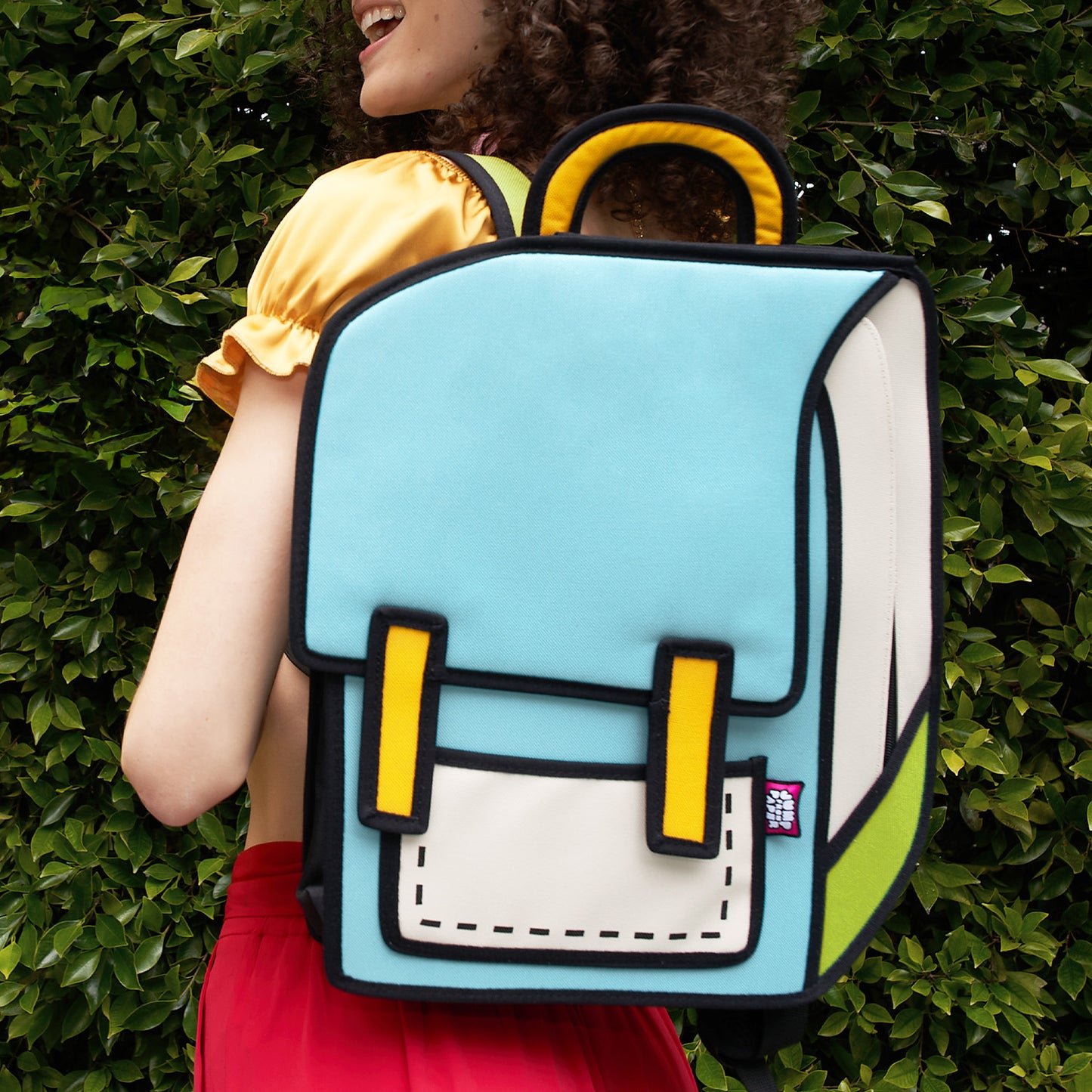 JumpFromPaper Spaceman 'Fluorescent Green' – blue and green 2D illusion cartoon backpack with spaceman-inspired design, front view