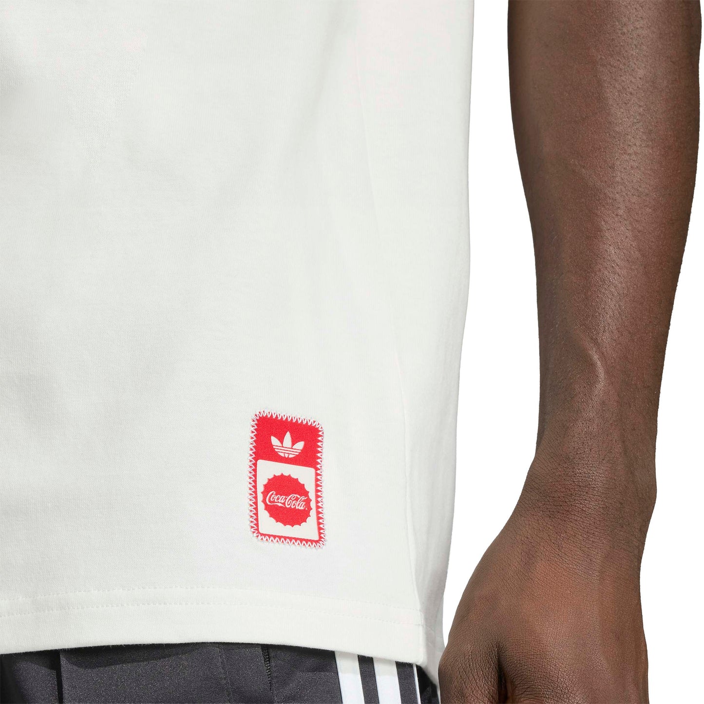 adidas Originals x Coca-Cola Classic Sport Graphic Treffie T-Shirt White graphic tee with Coca-Cola character artwork and adidas branding