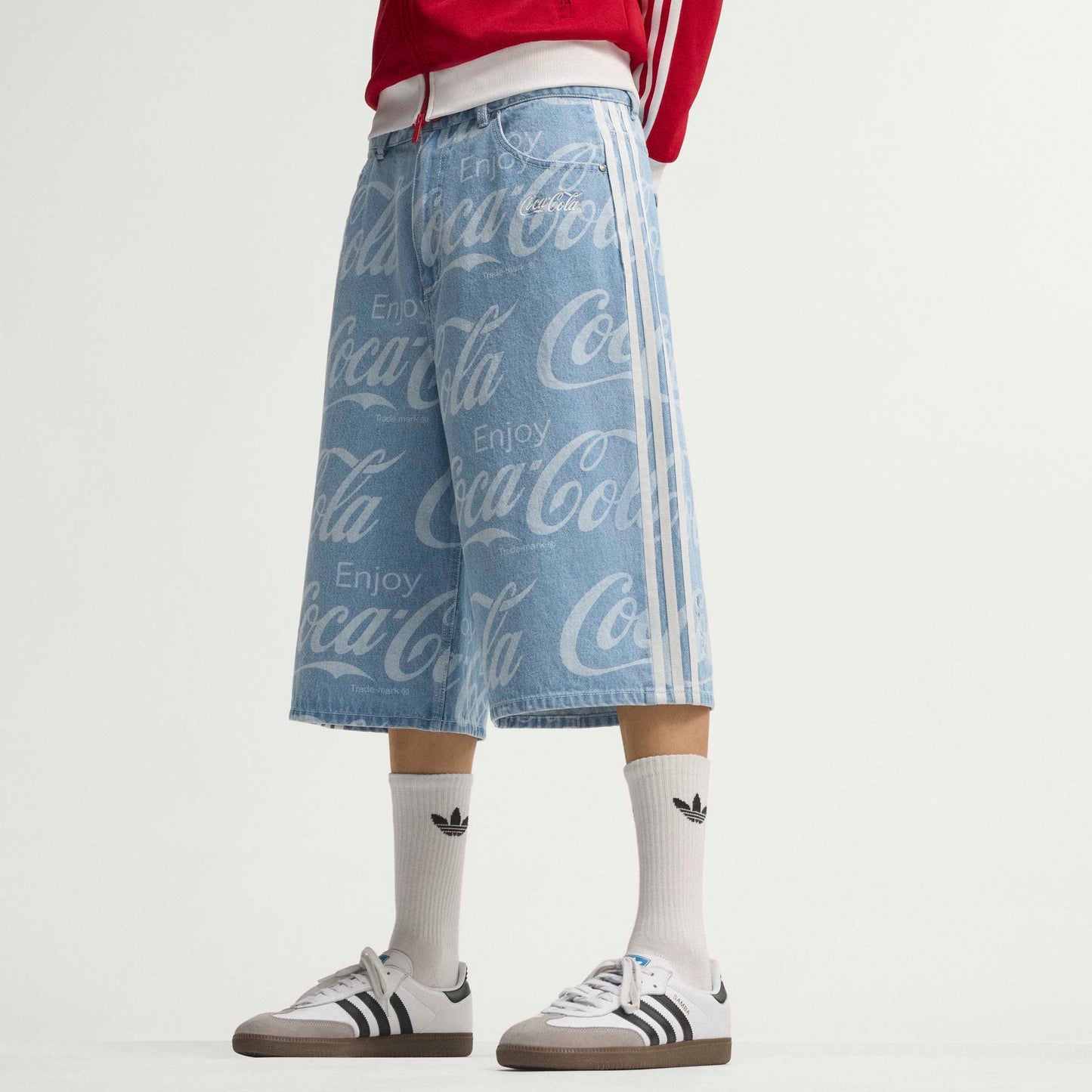 adidas Originals x Coca-Cola Classic Sport Denim Shorts Indigo Blue relaxed fit denim shorts with all-over Coca-Cola logo print