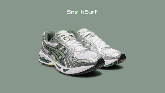 Image of the ASICS GEL-KAYANO 14 ‘White Slate Grey,’ a retro 2000s running-inspired sneaker featuring a breathable white mesh base, metallic silver overlays, and slate grey accents, blending performance heritage with modern streetwear appeal.