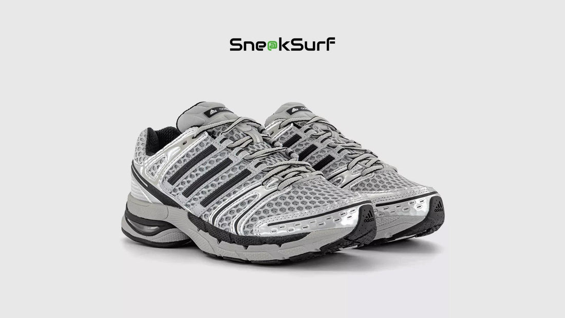 adidas Adistar Control 5 Silver Metallic running shoes with breathable mesh upper, enhanced stability support, cushioned sole, and metallic design accents in a performance footwear silhouette.