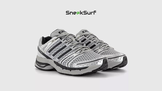 adidas Adistar Control 5 Silver Metallic running shoes with breathable mesh upper, enhanced stability support, cushioned sole, and metallic design accents in a performance footwear silhouette.