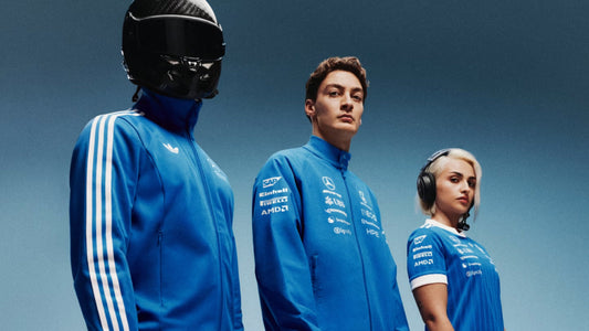 Models wearing the adidas Mercedes-AMG Petronas Formula 1 Team collection, featuring the Blue Wonder Driver Harrington Jacket, track jacket and official team apparel.