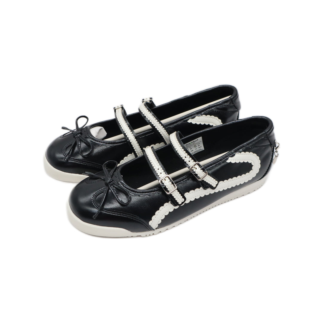 SneakSurf Mary Jane Black White/Cream - angled pair view showing the straps and outer sides