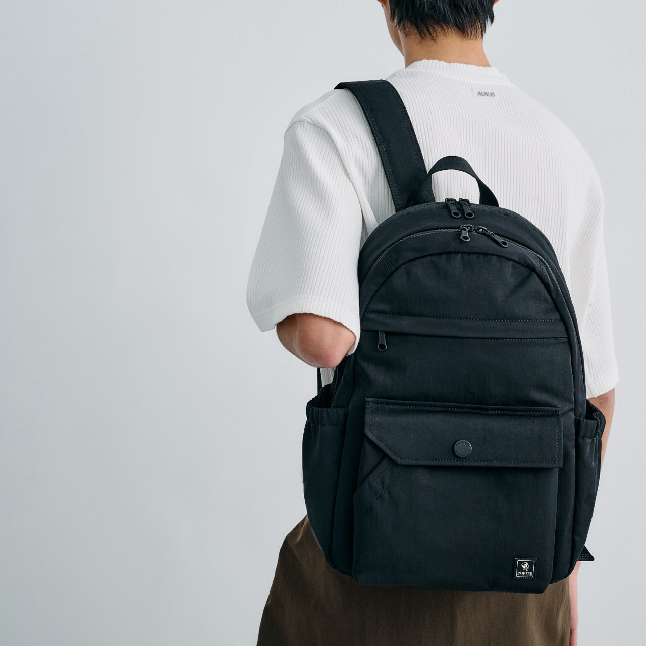 PORTER INTERNATIONAL Lapse Backpack Black textured fabric backpack front flap pocket zip compartments everyday carry