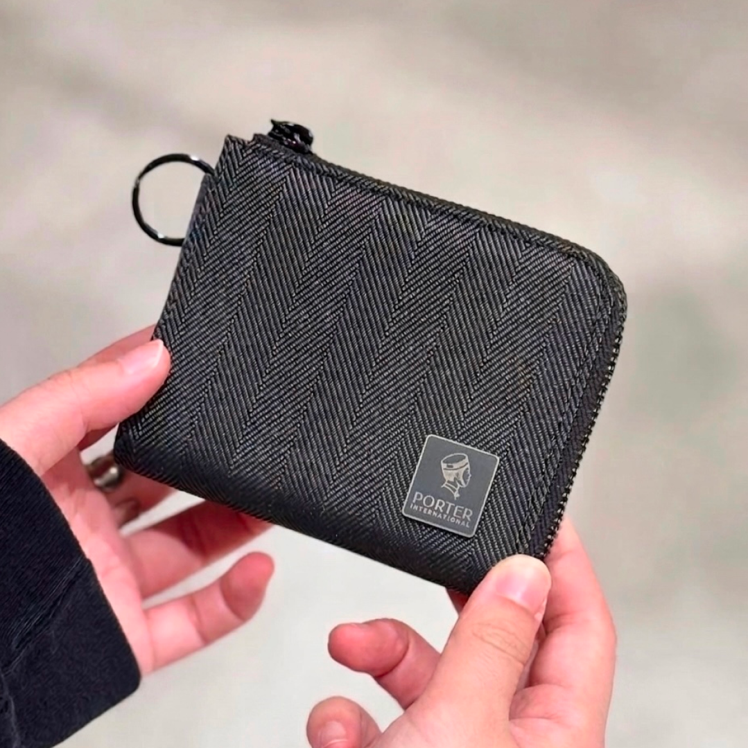PORTER INTERNATIONAL Melody L-Shaped Wallet 'Black' compact black wallet with an L-shaped zip closure for everyday essentials.