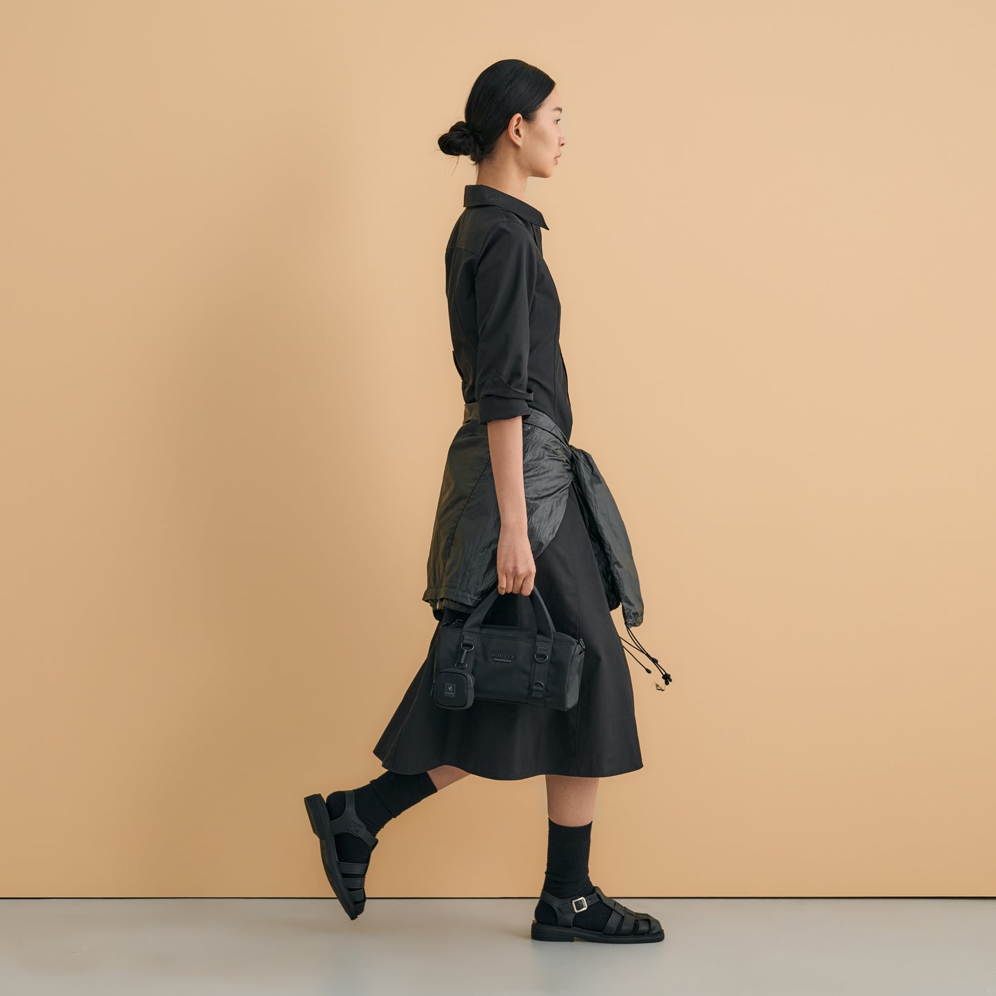 PORTER INTERNATIONAL Rollin Handbag M Black textured nylon shoulder bag cylindrical shape detachable strap mini pouch