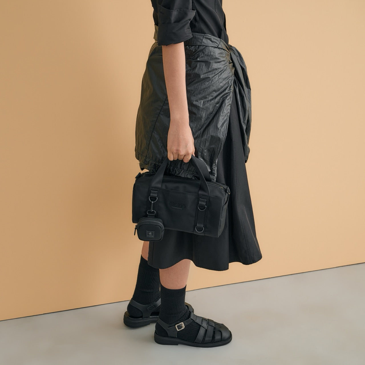 PORTER INTERNATIONAL Rollin Handbag M Black textured nylon shoulder bag cylindrical shape detachable strap mini pouch