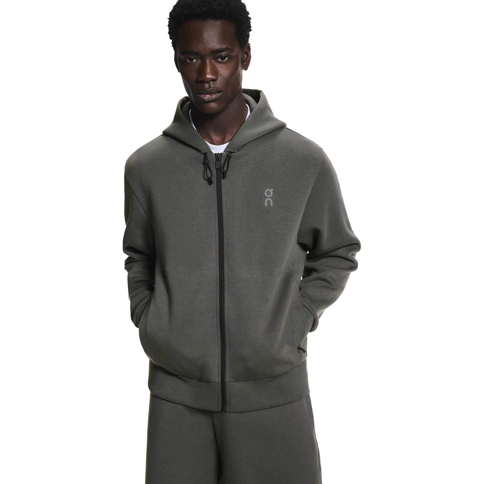 ON Cloud Focus Tech Zip Hoodie ‘Shadow’ – men’s olive grey performance zip hoodie with hood, slim athletic fit, front view worn by model