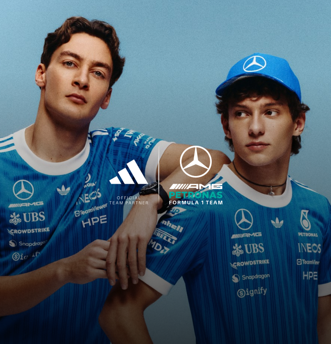 George Russell and Kimi Antonelli wearing the adidas x Mercedes-AMG Petronas Formula One Team Blue Wonder Collection, featuring the official Blue Wonder jersey and cap inspired by Mercedes motorsport heritage.