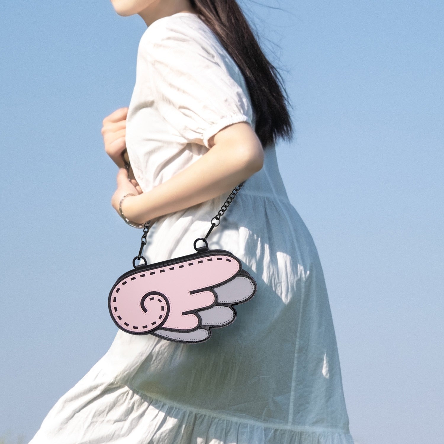 JumpFromPaper Cupid Cartoon Sling Bag Pink wing-shaped handbag with cartoon-inspired 2D illusion design and chain strap