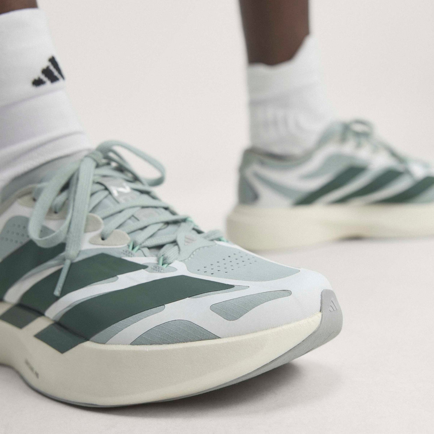 adidas Adizero Evo SL Exo Wonder Sage Silver Ivy White running shoe with LIGHTSTRIKE PRO midsole and breathable mesh upper