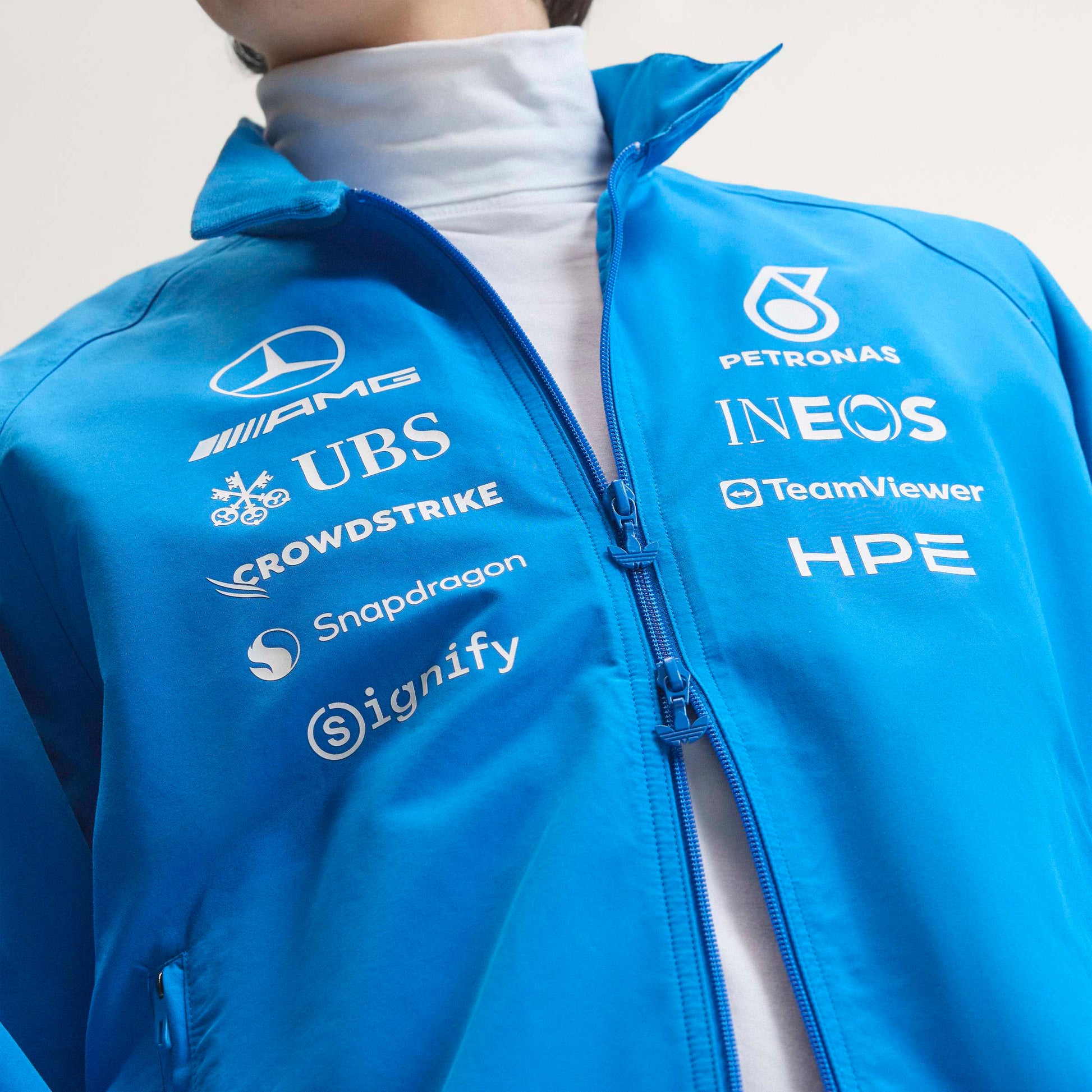 adidas Mercedes-AMG Petronas Formula One Team Blue Wonder Arrow Driver Harrington Jacket Blue White with official sponsor logos and full zip design