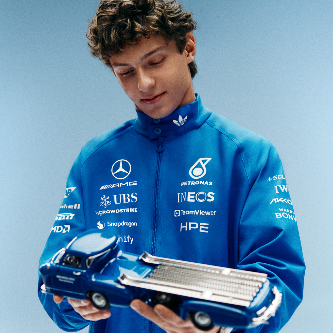 Kimi Antonelli wearing adidas Mercedes-AMG Petronas Formula One Team Blue Wonder Arrow Driver Harrington Jacket Blue White with official sponsor logos and full zip design