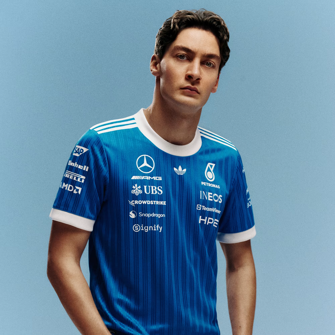 George Russell wearing adidas Mercedes-AMG Petronas Formula One Team Blue Wonder Authentic Driver Jersey Blue White with official sponsor logos and lightweight performance fabric
