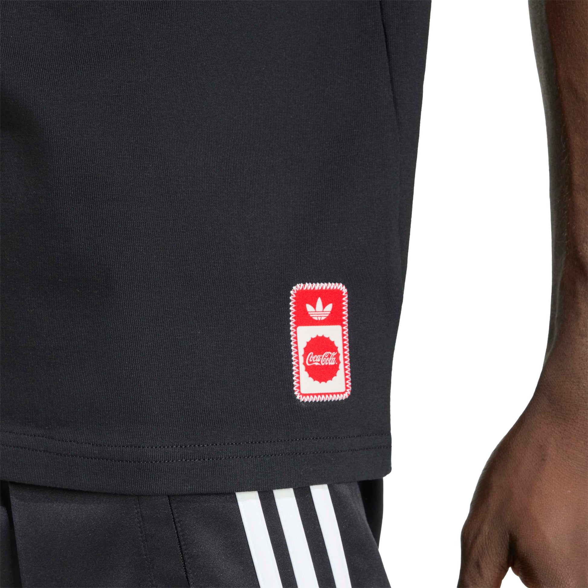 adidas Originals x Coca-Cola Classic Sport Graphic Treffie T-Shirt Black graphic tee with Coca-Cola character artwork and adidas branding
