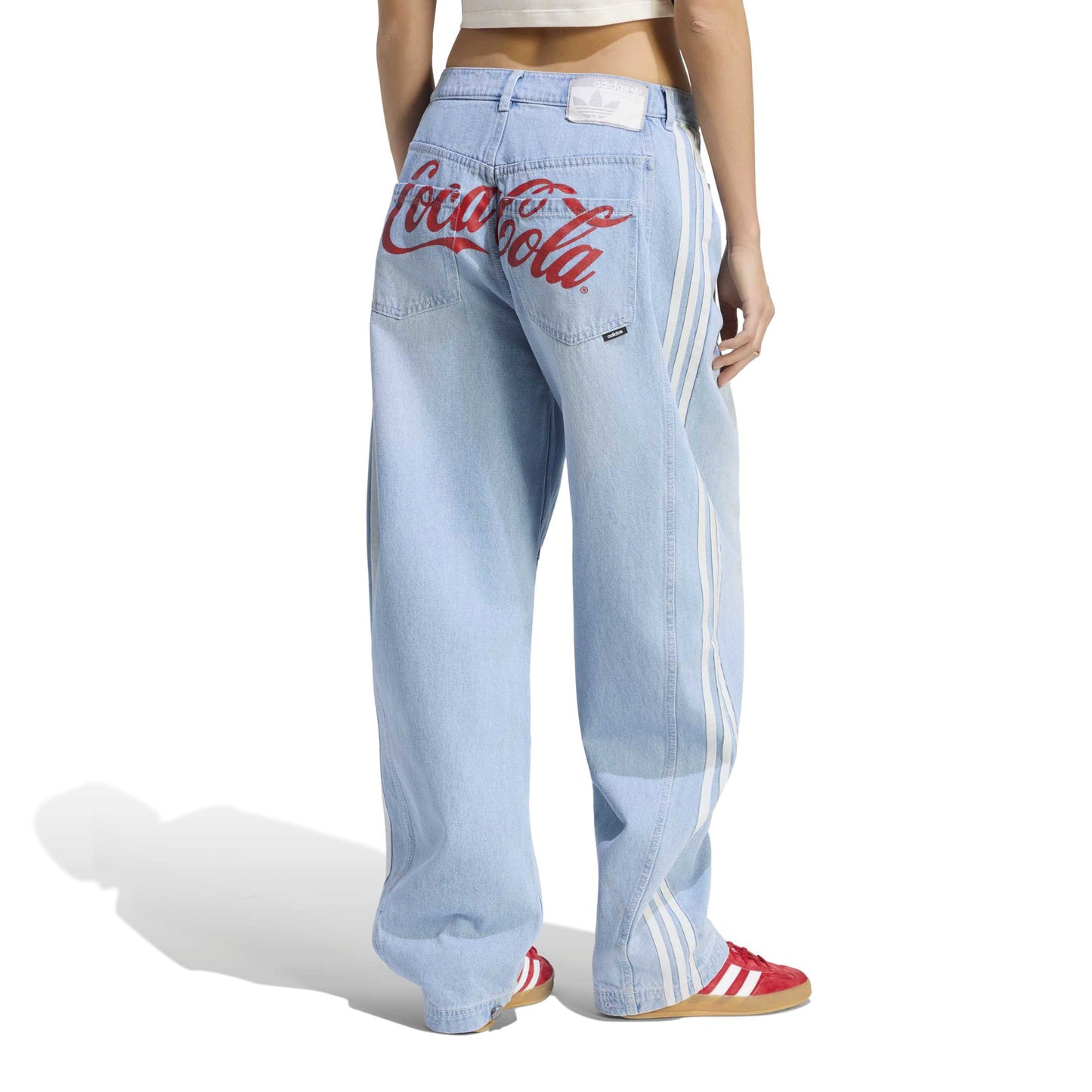 adidas Originals x Coca-Cola GFX Banana Pants Indigo Blue wide leg denim jeans with Coca-Cola graphic and adidas 3-Stripes