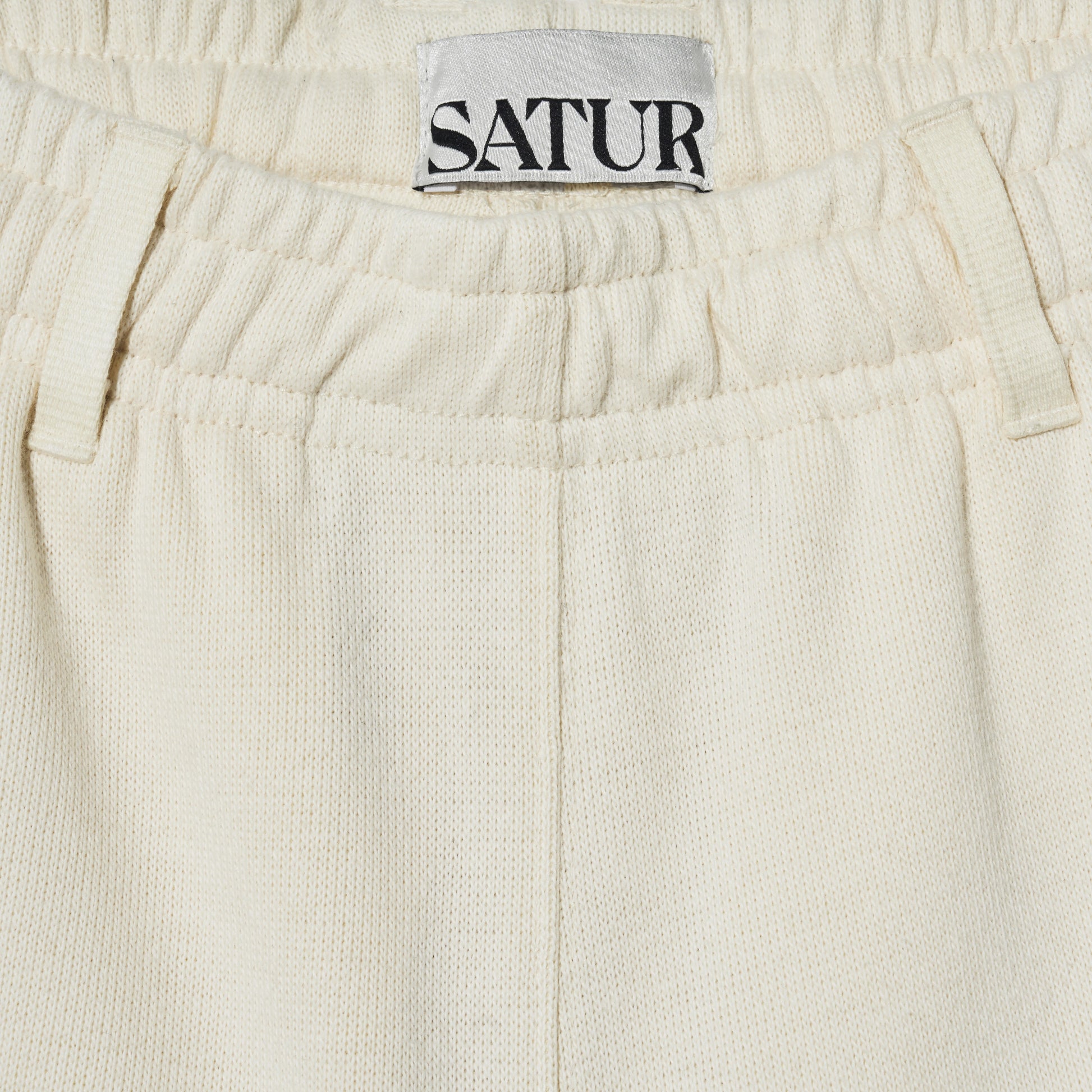 SATUR Lawton All Day Track Shorts Cream womens lightweight shorts elastic waistband side pockets embroidered logo casual apparel