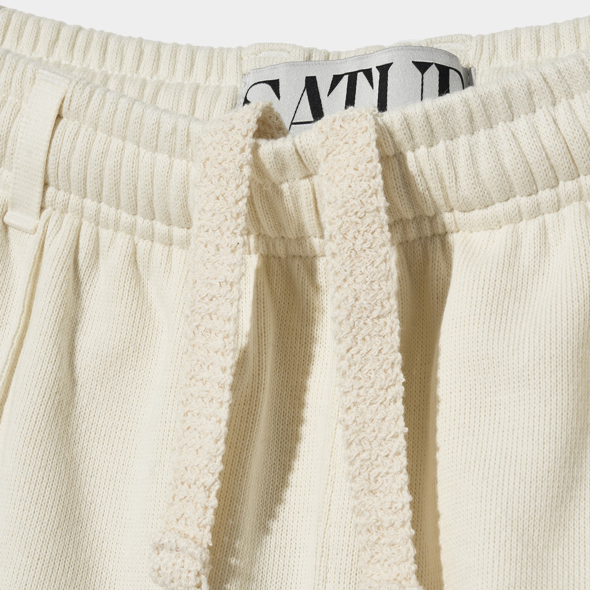 SATUR Lawton All Day Track Shorts Cream womens lightweight shorts elastic waistband side pockets embroidered logo casual apparel