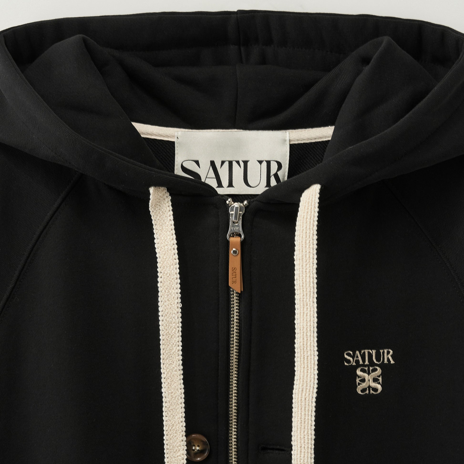 SATUR Loren Small Logo Hood Zip Up Black cotton blend hoodie full zip drawstring hood embroidered logo casual apparel