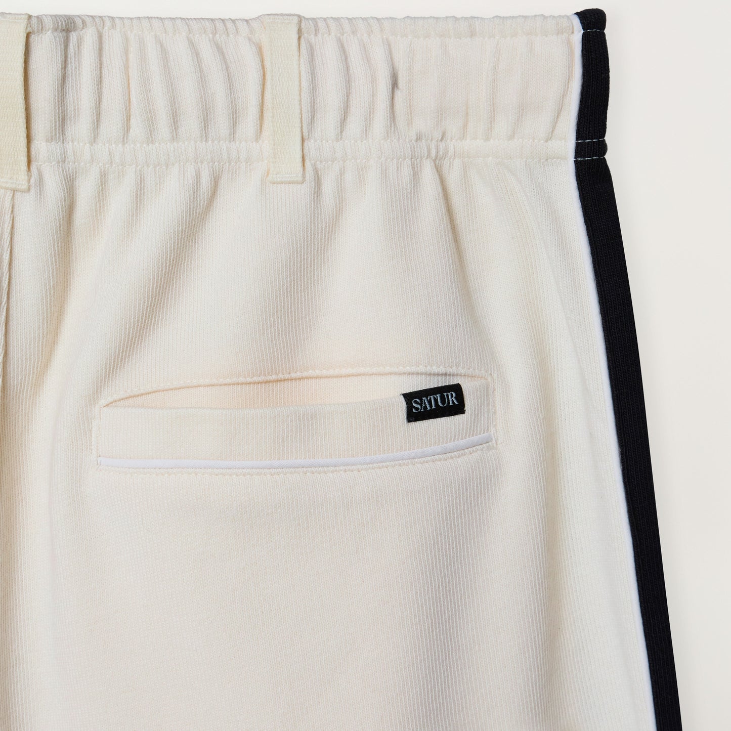 SATUR Lawton Lining Track Pants Cream Black womens lightweight track pants elastic waistband drawstring side stripe casual apparel