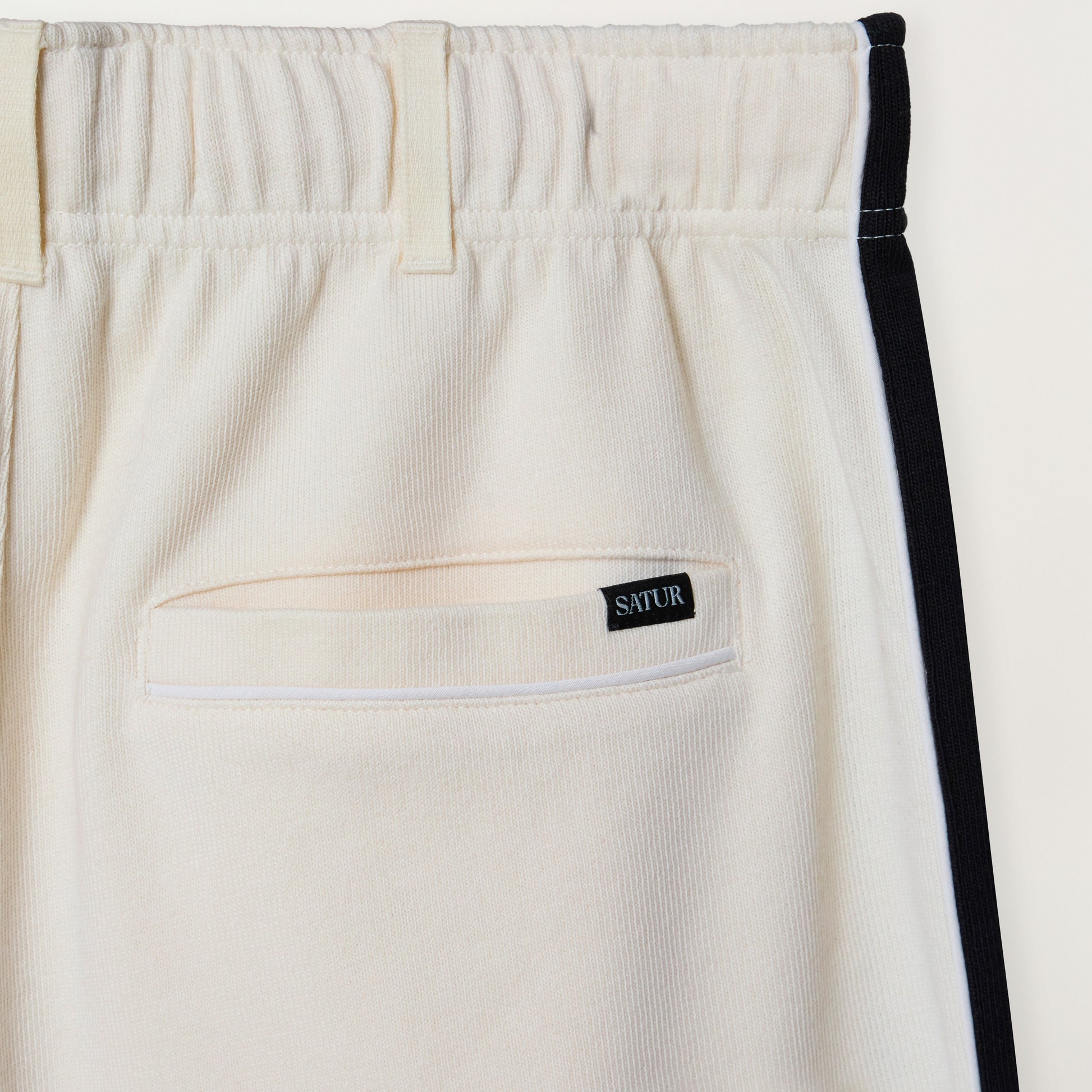 SATUR Lawton Lining Track Pants Cream Black womens lightweight track pants elastic waistband drawstring side stripe casual apparel