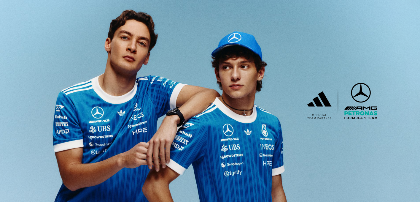 George Russell and Kimi Antonelli wearing the adidas x Mercedes-AMG Petronas Formula One Team Blue Wonder Collection, featuring the official Blue Wonder jersey, cap, and Formula 1-inspired apparel.